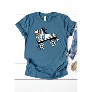 navy blue tee with image of roller skate and words keep rollin' written inside of skate.