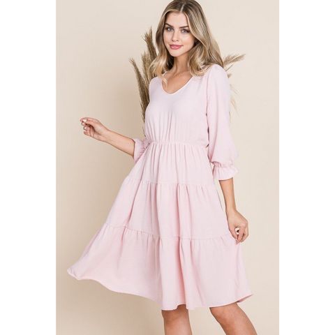 pink tiered dress with 3/4 length sleeves