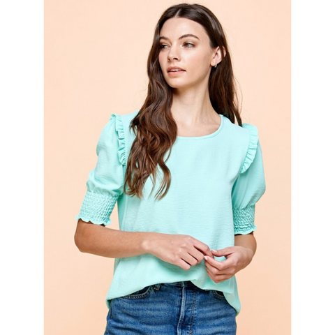 mint colored shirt with ruffled and smocked sleeve