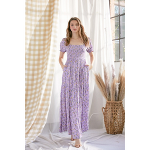 Floral purple maxi dress with smocked bodice and puffy sleeves.