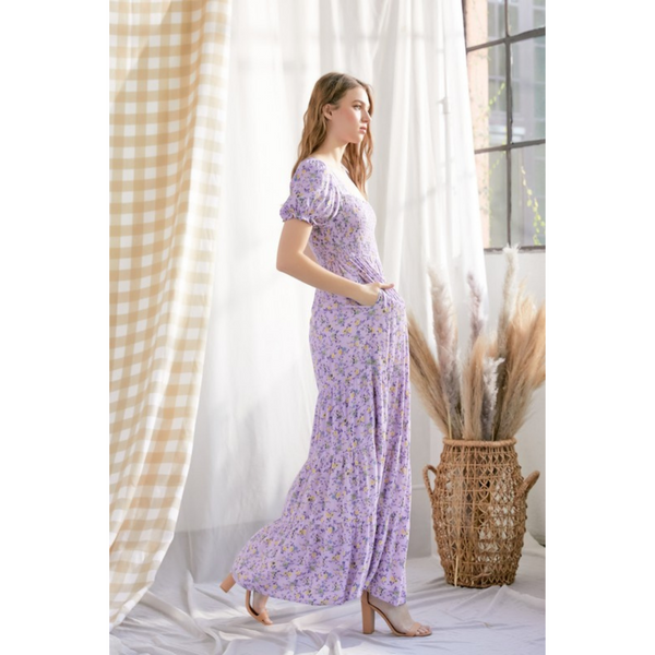 side view of Floral purple maxi dress with smocked bodice and puffy sleeves.