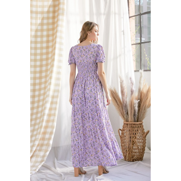 back view of Floral purple maxi dress with smocked bodice and puffy sleeves.